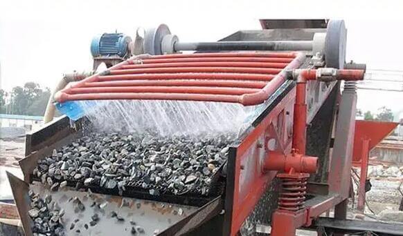 Vibrating stone washing machine